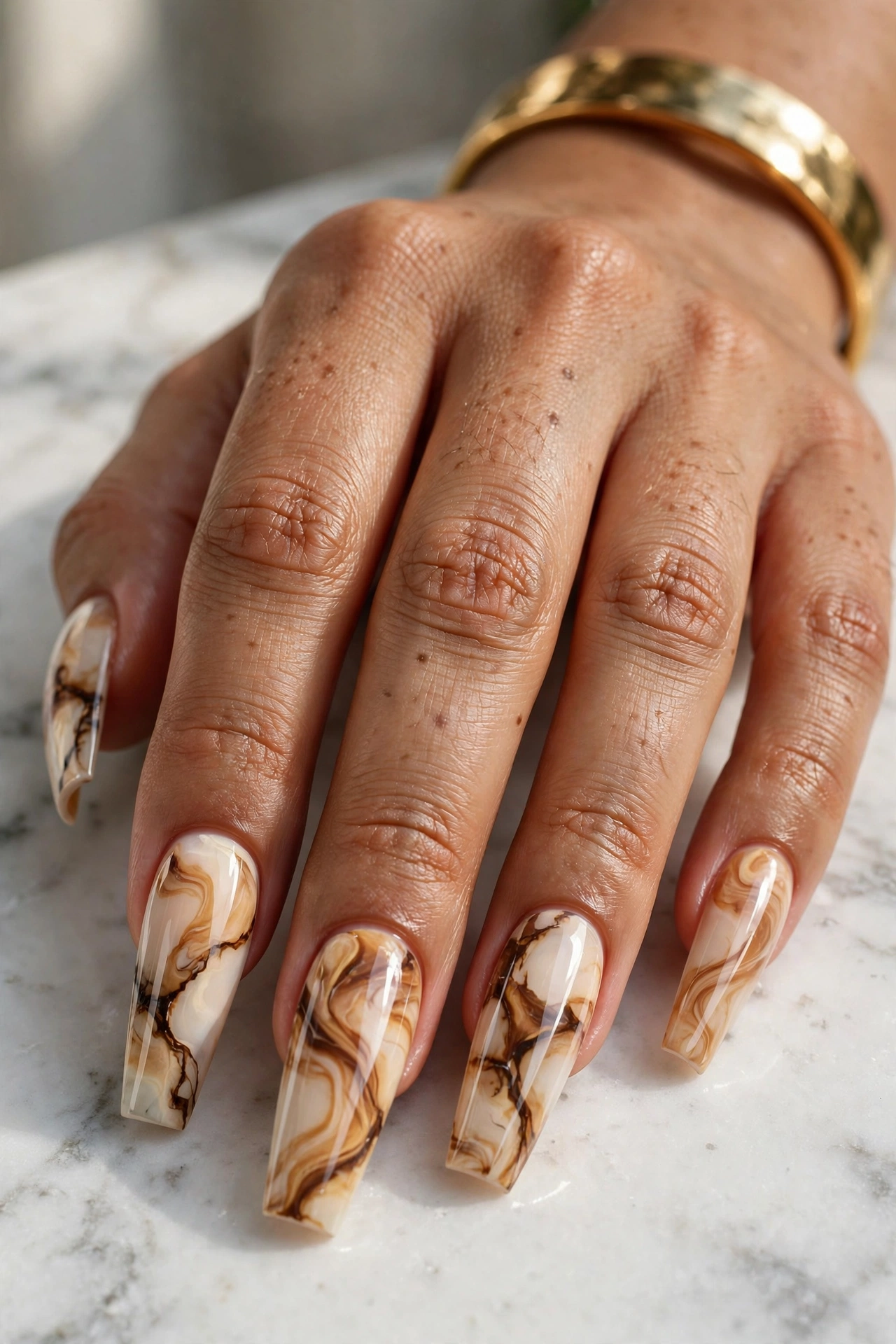 Caramel marble coffin nails with flowing toffee veins