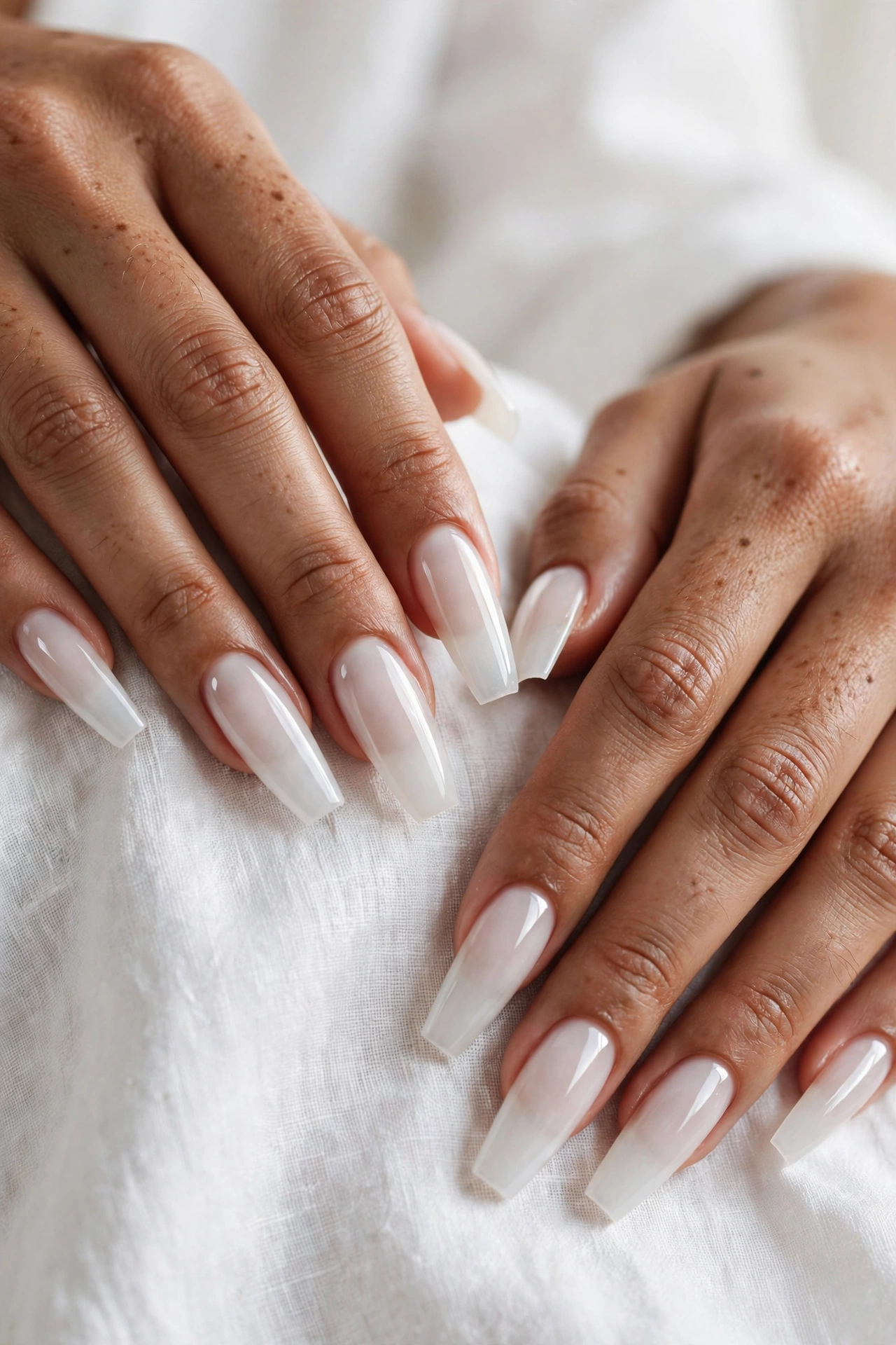 Milky white coffin nails with sheer glazed finish