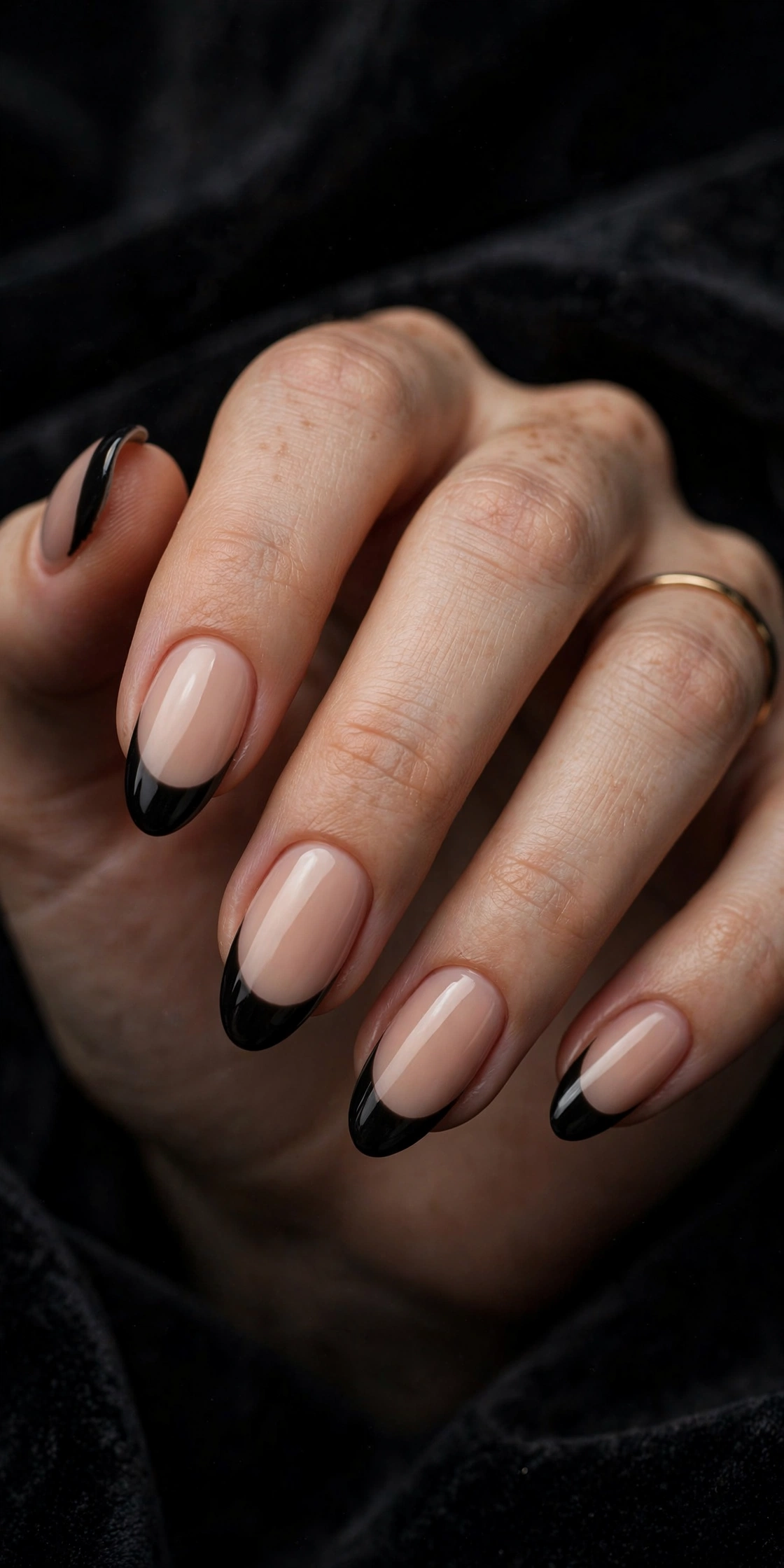Black French tip nails with nude base