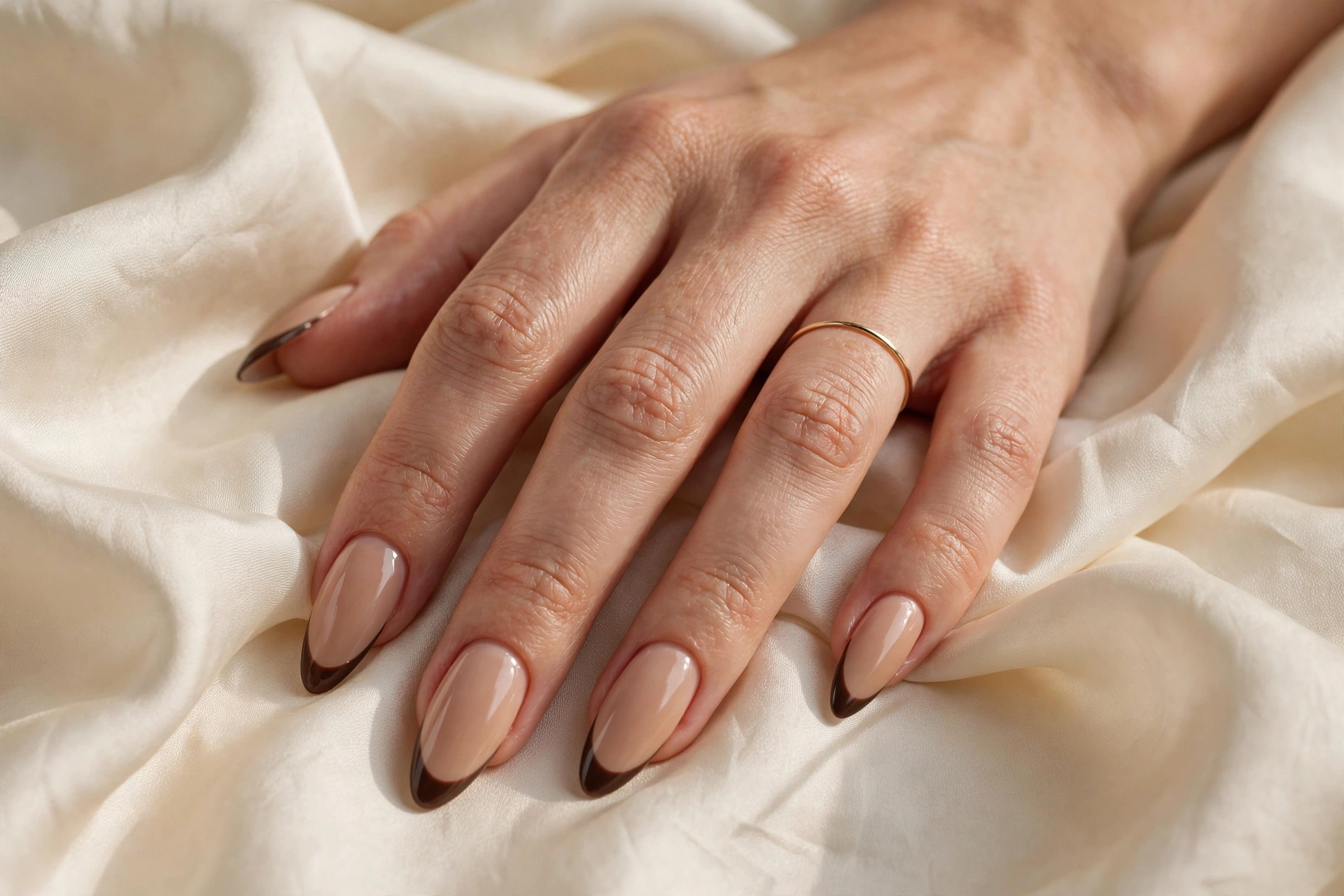 Espresso-tipped French latte nail designs on long almond nails